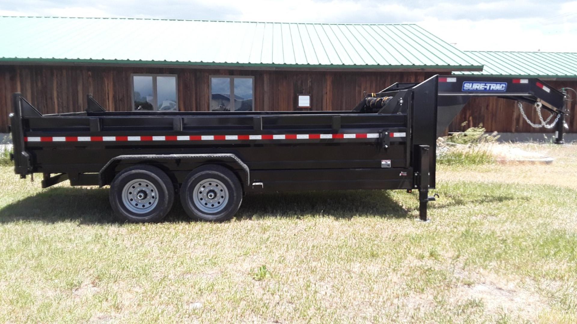 2024 Black SureTrac 7 x 14 LoPro Dump , located at 310 West 1st Ave, Big Timber, MT, 59011, (406) 860-8510, 45.833511, -109.957809 - SURE-TRAC 7 x 14 LO PRO DUMP TRAILER, 14K GVW, TELESCOPIC HOIST, UNDERBODY TOOL STORAGE BOX, STAKE POCKETS ON SIDE, MESH TARP, 110 VOLT BATTERY CHARGER, SIDE STEP, EZ LUBE HUBS, HD SLIPPER SPRING SUSPENSION, 16" RADIAL 10 PLY TIRES, BRAKES BOTH AXLES, SPREADER-BARN DOOR REAR GATE, REAR RAMPS, 10 GA - Photo#5