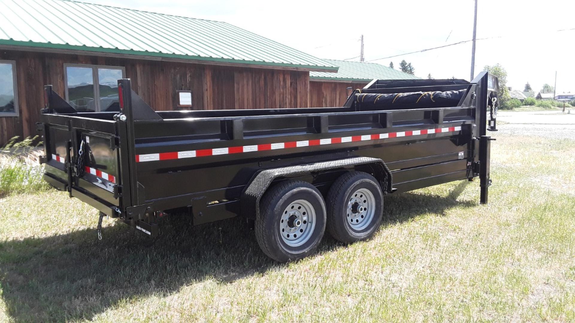 2024 Black SureTrac 7 x 14 LoPro Dump , located at 310 West 1st Ave, Big Timber, MT, 59011, (406) 860-8510, 45.833511, -109.957809 - SURE-TRAC 7 x 14 LO PRO DUMP TRAILER, 14K GVW, TELESCOPIC HOIST, UNDERBODY TOOL STORAGE BOX, STAKE POCKETS ON SIDE, MESH TARP, 110 VOLT BATTERY CHARGER, SIDE STEP, EZ LUBE HUBS, HD SLIPPER SPRING SUSPENSION, 16" RADIAL 10 PLY TIRES, BRAKES BOTH AXLES, SPREADER-BARN DOOR REAR GATE, REAR RAMPS, 10 GA - Photo#2