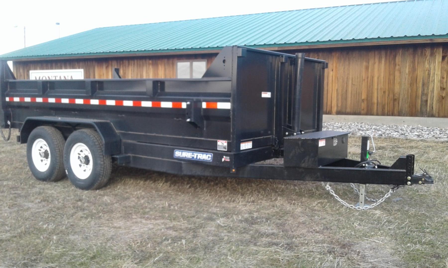 2024 Black SureTrac 7 x 14 LoPro Dump , located at 310 West 1st Ave, Big Timber, MT, 59011, (406) 860-8510, 45.833511, -109.957809 - SURE-TRAC 7 x 14 LO PRO DUMP TRAILER, 14K GVW, TELESCOPIC HOIST, UNDERBODY TOOL STORAGE BOX, STAKE POCKETS ON SIDE, MESH TARP, 110 VOLT BATTERY CHARGER, SIDE STEP, EZ LUBE HUBS, HD SLIPPER SPRING SUSPENSION, 16" RADIAL 10 PLY TIRES, BRAKES BOTH AXLES, SPREADER-BARN DOOR REAR GATE, REAR RAMPS, 10 GA - Photo#9