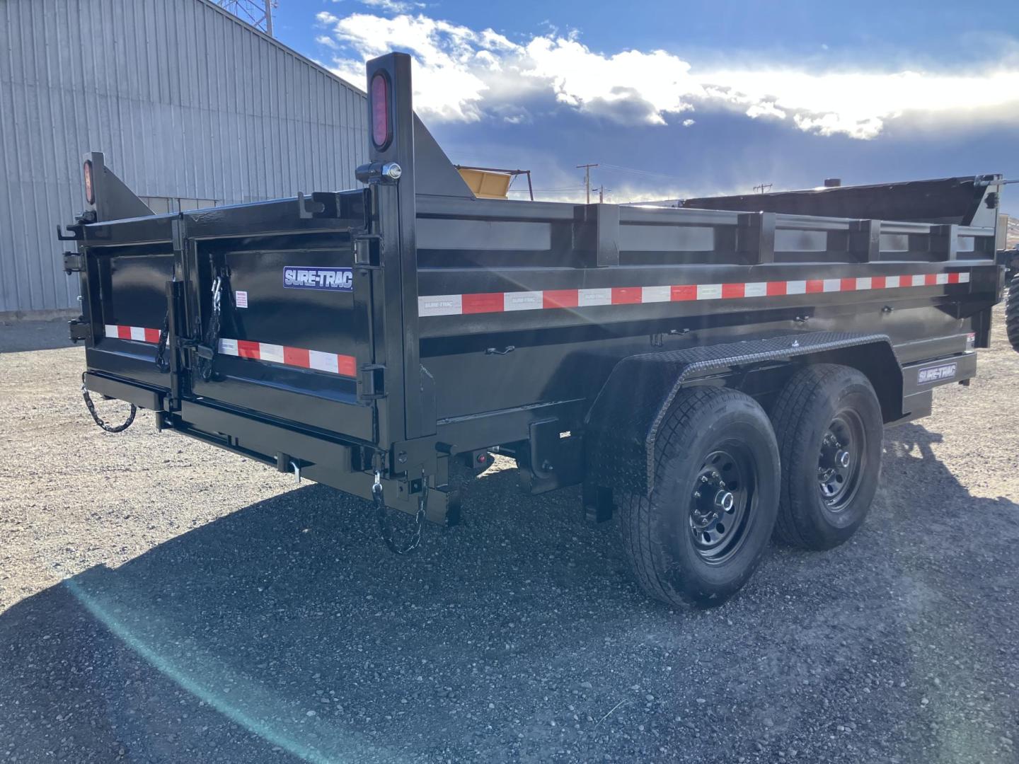 2025 Black SureTrac 7 x 14 LoPro Dump , located at 310 West 1st Ave, Big Timber, MT, 59011, (406) 860-8510, 45.833511, -109.957809 - SURE-TRAC 7 x 14 HD LO PRO DUMP TRAILER, 14K GVW, TELESCOPIC HOIST, UNDERBODY TOOL STORAGE BOX, STAKE POCKETS ON SIDE, MESH TARP, 110 VOLT BATTERY CHARGER, SIDE STEP, EZ LUBE HUBS, HD SLIPPER SPRING SUSPENSION, 16" RADIAL 10 PLY TIRES, BRAKES BOTH AXLES, SPREADER-BARN DOOR REAR GATE, REAR RAMPS, 10 - Photo#14