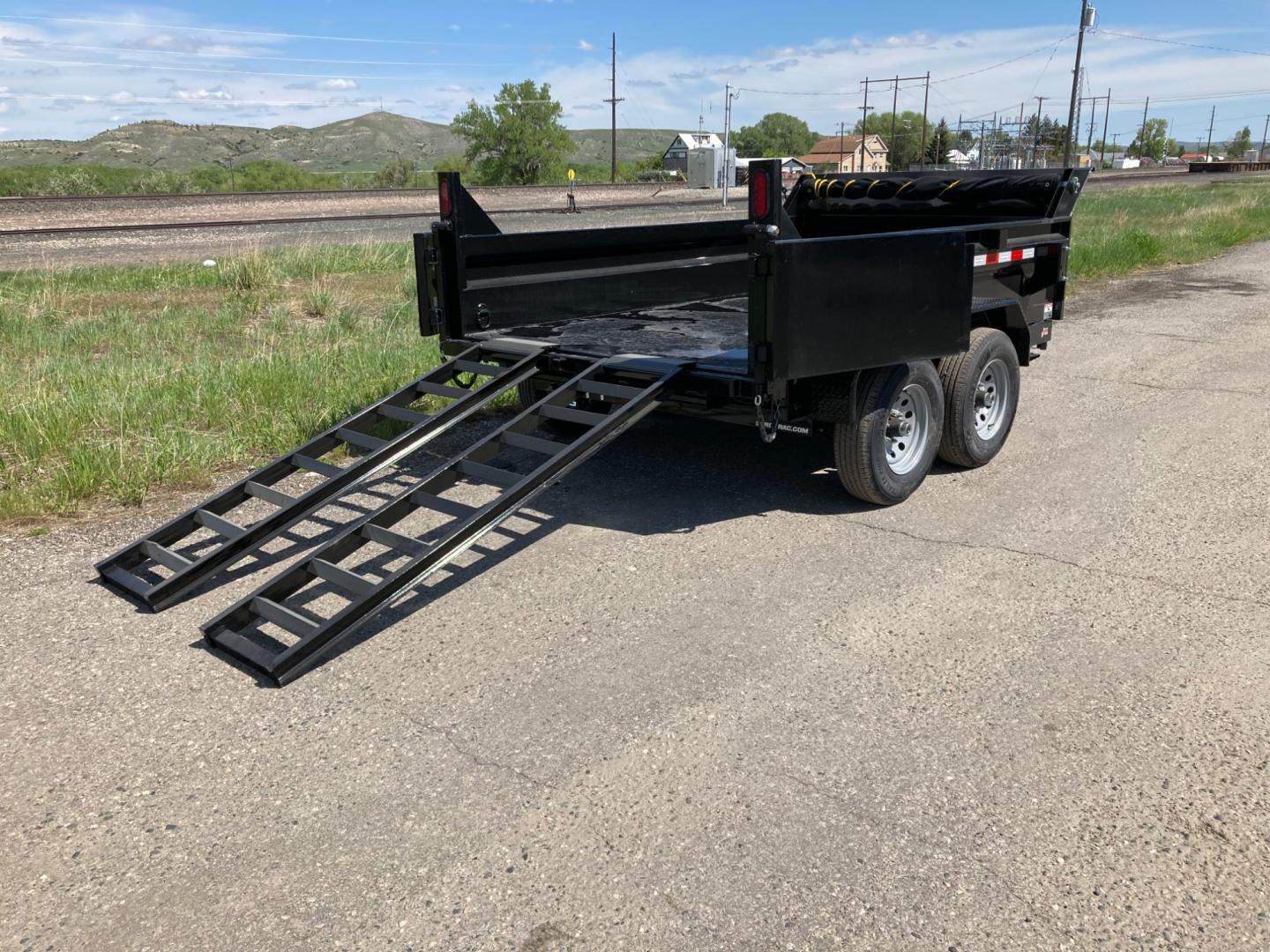 2025 Black SureTrac 6 x10 Lo Pro Dump Trailer , located at 310 West 1st Ave, Big Timber, MT, 59011, (406) 860-8510, 45.833511, -109.957809 - SURE-TRAC 6 X 10 LO PRO DUMP TRAILER, 10K GVW, SINGLE RAM HOIST WITH POWER UP/DOWN, EZ LUBE HUBS, DUAL REAR GATE, ELECTRIC BRAKES BOTH AXLES, (5) D-RING TIE-DOWNS, LED LIGHTS, REAR STOW RAMPS, MESH TARP, DEEP CYCLE BATTERY, 225-15" - 8 PLY RADIAL TIRES, SPARE TIRE CARRIER, 7K DROP FOOT JACK, LOCKABL - Photo#5