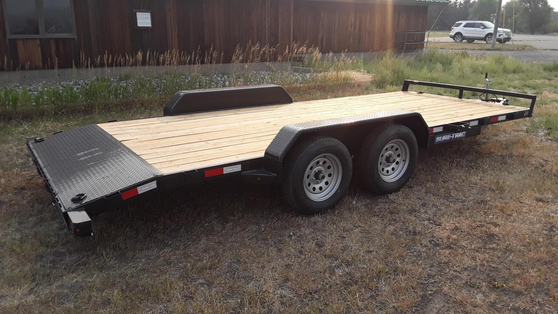 2025 Black SureTrac 7 x 18 - 7K Car Hauler , located at 310 West 1st Ave, Big Timber, MT, 59011, (406) 860-8510, 45.833511, -109.957809 - SURE-TRAC 7 X 18 C-CHANNEL CAR HAULER, 7K GVW, ELECTRIC BRAKES BOTH AXLES, REAR STOW RAMPS, LED LIGHTS, TREATED WOOD DECK, POWDER COAT FINISH, REMOVABLE FENDER ON DRIVERS SIDE, (4) D-RING TIE DOWNS, STAKE POCKETS, 2' TREAD PLATE DOVETAIL, EZ LUBE HUBS, 15' RADIAL TIRES, SPRING SUSPENSION, SPARE MOUN - Photo#2