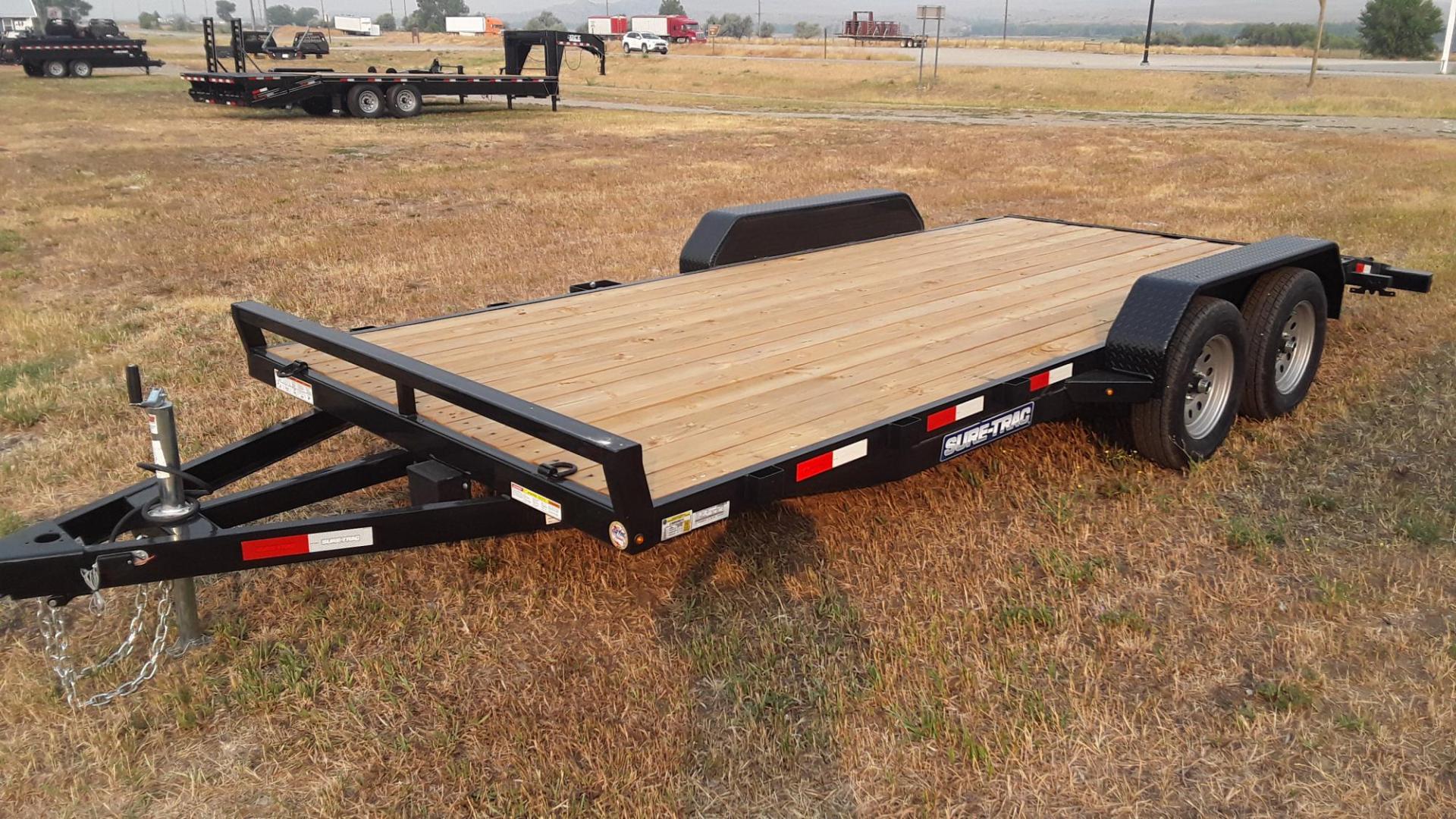 2025 Black SureTrac 7 x 18 - 7K Car Hauler , located at 310 West 1st Ave, Big Timber, MT, 59011, (406) 860-8510, 45.833511, -109.957809 - SURE-TRAC 7 X 18 C-CHANNEL CAR HAULER, 7K GVW, ELECTRIC BRAKES BOTH AXLES, REAR STOW RAMPS, LED LIGHTS, TREATED WOOD DECK, POWDER COAT FINISH, REMOVABLE FENDER ON DRIVERS SIDE, (4) D-RING TIE DOWNS, STAKE POCKETS, 2' TREAD PLATE DOVETAIL, EZ LUBE HUBS, 15' RADIAL TIRES, SPRING SUSPENSION, SPARE MOUN - Photo#4