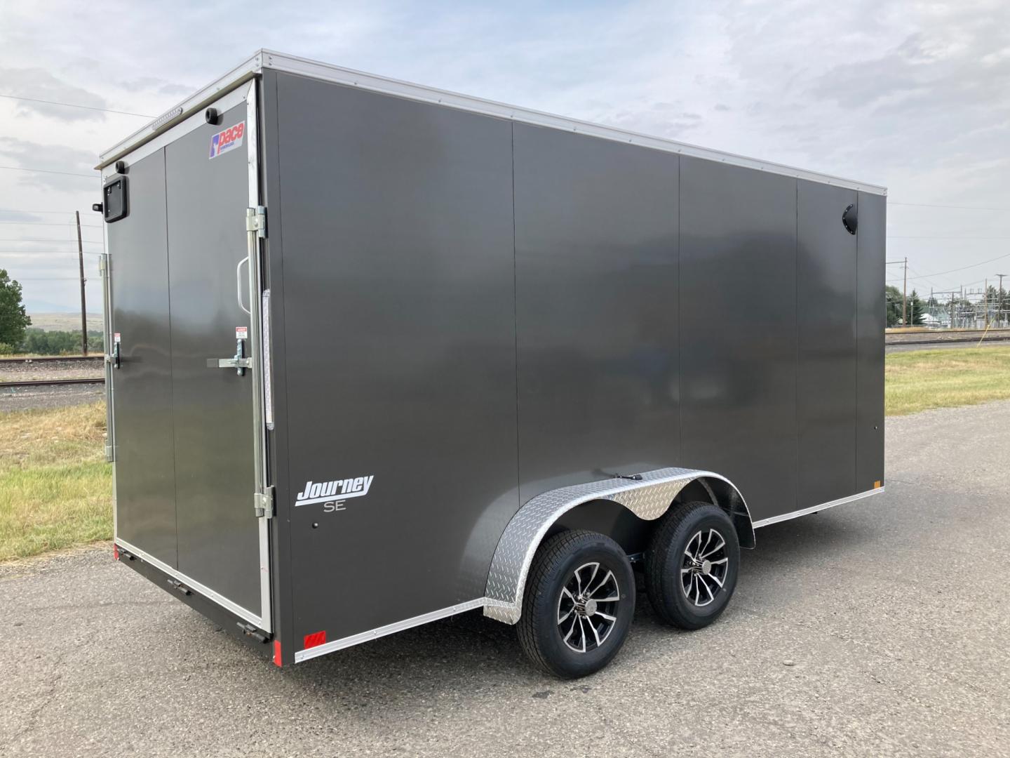 2025 Charcoal Pace 7 x 16 Journey SE , located at 310 West 1st Ave, Big Timber, MT, 59011, (406) 860-8510, 45.833511, -109.957809 - NEW PACE 7 X 16 JOURNEY SE V-NOSE CARGO TRAILER, 7K GVW, 78" REAR OPENING DOOR HEIGHT, TUBE SIDEWALL SUPPORTS ON 16" CENTERS, FLOOR CROSSMEMBERS ON 16" CENTERS, BONDED EXTERIOR (SCREWLESS), TUBE FRAME CONSTRUCTION, 15" RADIAL TIRES, EZ LUB HUBS, REAR RAMP DOOR, FLUSH MOUNTED RV SIDE DOOR W- LOCK, BR - Photo#0