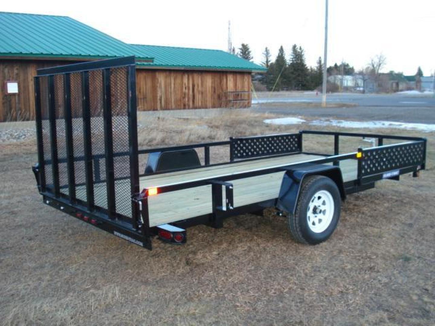 2025 Black SureTrac 7 x 14 ATV , located at 310 West 1st Ave, Big Timber, MT, 59011, (406) 860-8510, 45.833511, -109.957809 - SURE-TRAC 7 X 14 TUBE TOP ATV, 3K GVW, SIDE RAMPS, SPRING ASSISTED REAR RAMP, 15" RADIAL TIRES, TREATED WOOD DECK, LED LIGHTS, WIRING RUN IN CONDUIT, POWDER COAT FINISH, SPARE TIRE MOUNT. SURE-TRAC QUALITY FIT AND FINISH. OPTIONAL SPARE TIRE - $165.00. THE BEST TRAILERS AT THE BEST PRICE!!! Traile - Photo#2