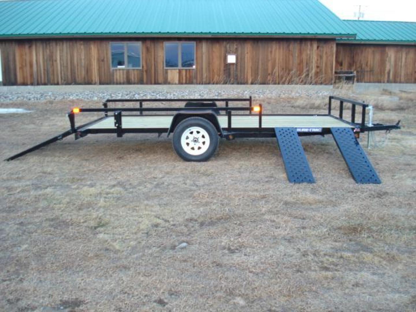 2025 Black SureTrac 7 x 14 ATV , located at 310 West 1st Ave, Big Timber, MT, 59011, (406) 860-8510, 45.833511, -109.957809 - SURE-TRAC 7 X 14 TUBE TOP ATV, 3K GVW, SIDE RAMPS, SPRING ASSISTED REAR RAMP, 15" RADIAL TIRES, TREATED WOOD DECK, LED LIGHTS, WIRING RUN IN CONDUIT, POWDER COAT FINISH, SPARE TIRE MOUNT. SURE-TRAC QUALITY FIT AND FINISH. OPTIONAL SPARE TIRE - $165.00. THE BEST TRAILERS AT THE BEST PRICE!!! Traile - Photo#5