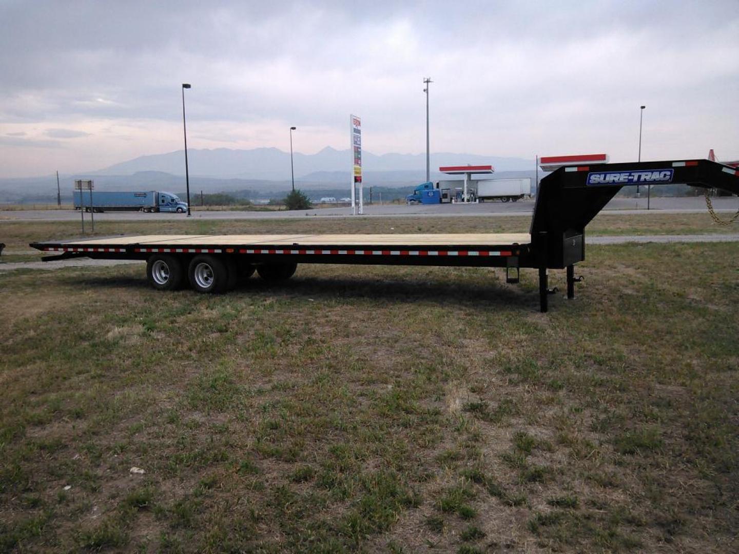 2025 Black SureTrac 81/2 x 35 GN Deckover w/ Power Dovetail , located at 310 West 1st Ave, Big Timber, MT, 59011, (406) 860-8510, 45.833511, -109.957809 - Photo#0