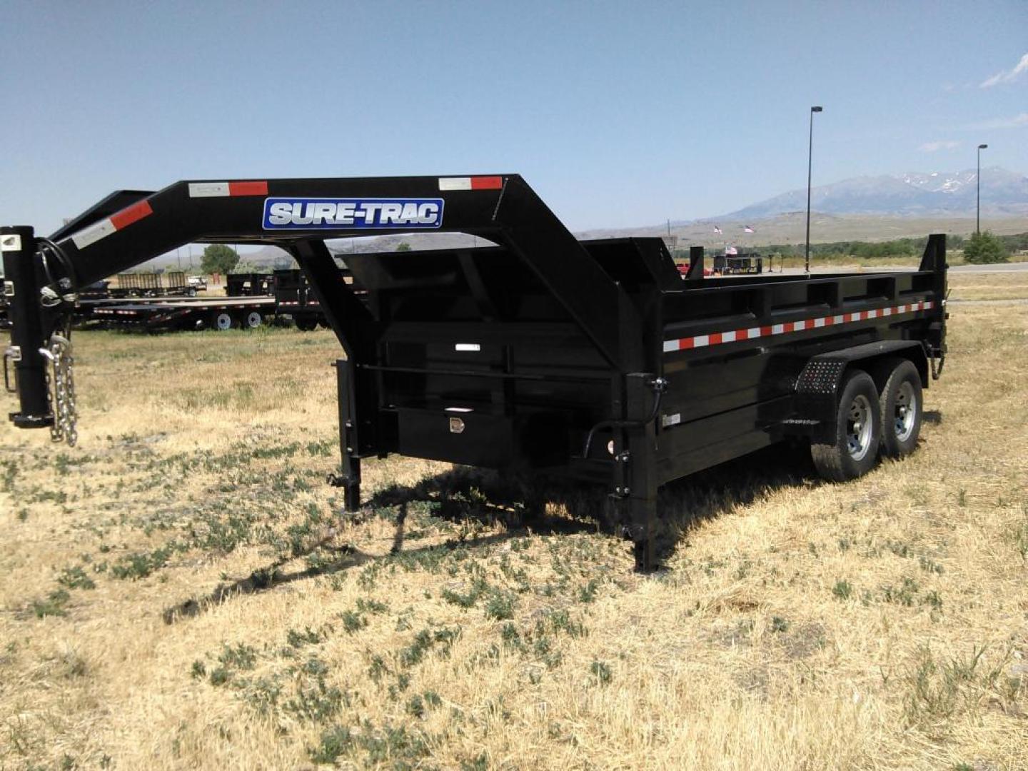 2025 Black SureTrac 7 x 14 GN LoPro Dump , located at 310 West 1st Ave, Big Timber, MT, 59011, (406) 901-0517, 45.833511, -109.957809 - NEW SURE-TRAC 7 X 14 LOPRO GN DUMP, 14K GVW, HD TELESCOPIC HOIST, 7 GA FLOOR, HD SLIPPER SPRING SUSPENSION, 7K AXLES W- EZ LUBE HUBS, LED LIGHTS, ELECTRIC BRAKES BOTH AXLES, COMBO BARN DOOR-SPREADER REAR GATE, HD REAR STOW RAMPS, 10 PLY - 16" RADIAL TIRES, STAKE POCKETS, ADJUSTABLE GN COUPLER, (5) D - Photo#3