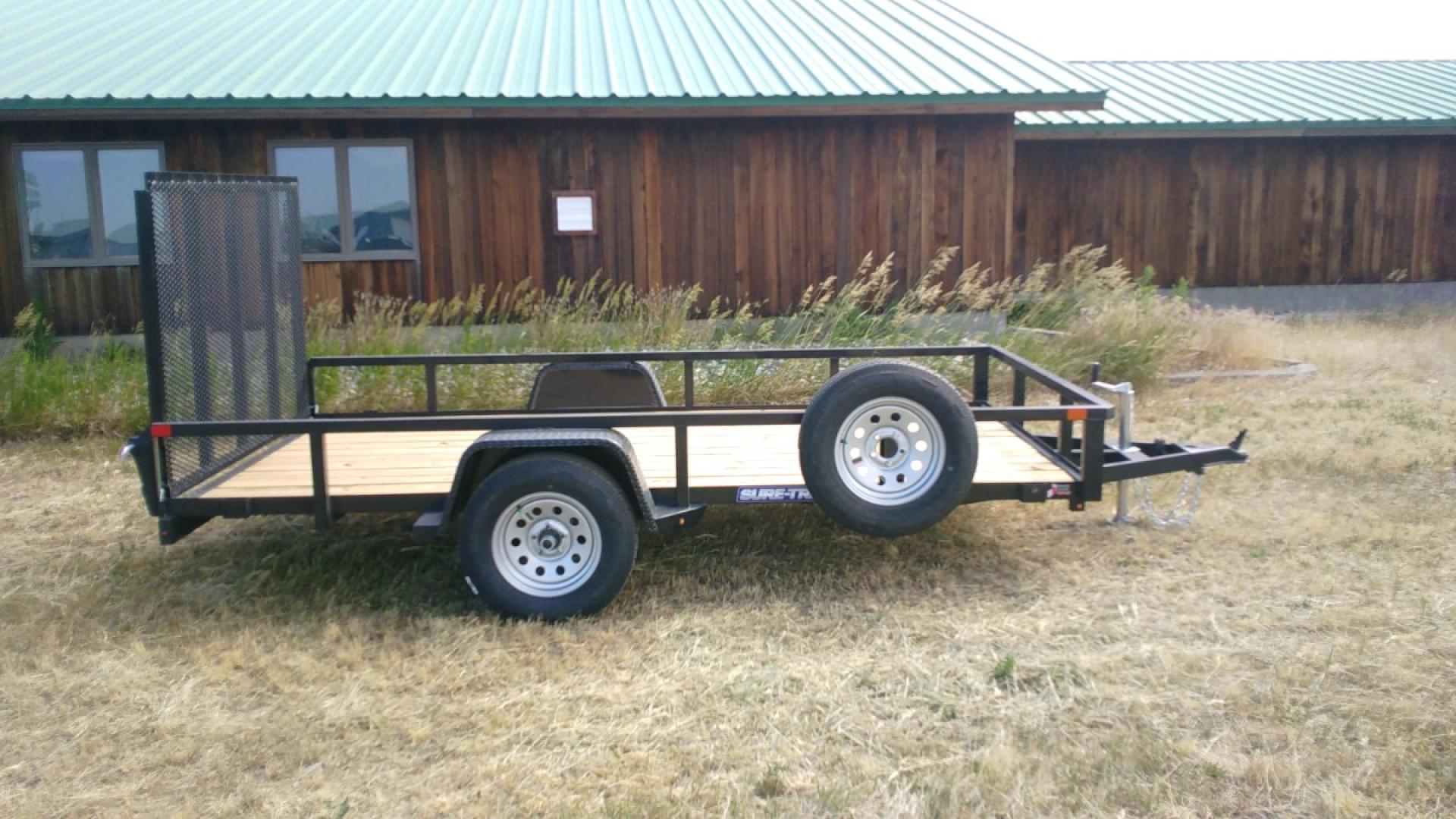 2025 SureTrac , located at 310 West 1st Ave, Big Timber, MT, 59011, (406) 901-0517, 45.833511, -109.957809 - SureTrac 7 x 12 Tube Top Utility, 3k GVW, 15" radial tires, easy lube hubs, 2" x 2" top tube rail, tube uprights, tread plate fenders, spare mount, fold flat rear gate with spring assist, treated 2 x 6 wood deck, wiring enclosed in tubing, LED lights, powder coat finish. Trailer pictured with option - Photo#5