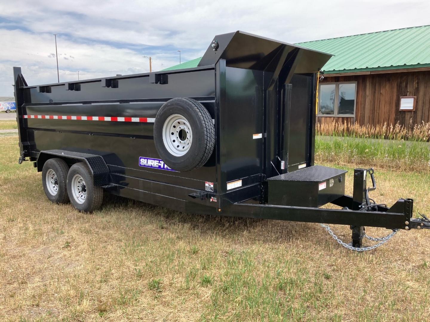 2024 SureTrac 7 x 16 LoPro dump - 14K GVW , located at 310 West 1st Ave, Big Timber, MT, 59011, (406) 860-8510, 45.833511, -109.957809 - SureTrac 7 x 16 LoPro Dump, 14k GVW, 4' side walls, telescopic hoist, HD slipper spring suspension, 16" - 10 ply radial tires, ez lube hubs, matching spare tire, mesh tarp, 110 volt battery charger, set back 12k drop leg jack, (5) D-ring tie downs, 10 ga floor, all LED lights, rear stow ramps, HD ma - Photo#4